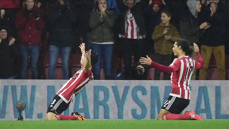 Maya Yoshida (L) celebrates with team mate Virgil van Dijk