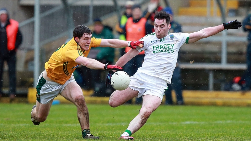 Fermanagh's Barry Mulrone with Padraic Harnan of Meath