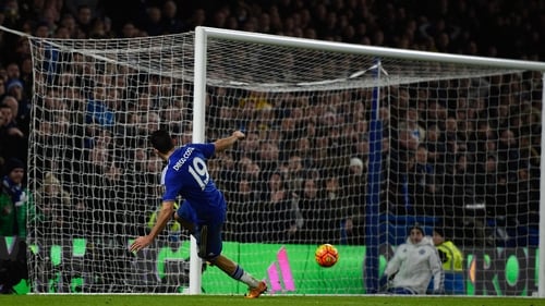 Diego Costa slides home at the second attempt to earn Chelsea a draw