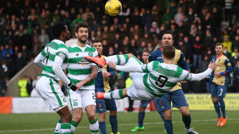 Leigh Griffiths acrobatically shoots on goal