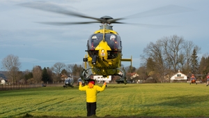 A helicopter leaves the scene of the crash