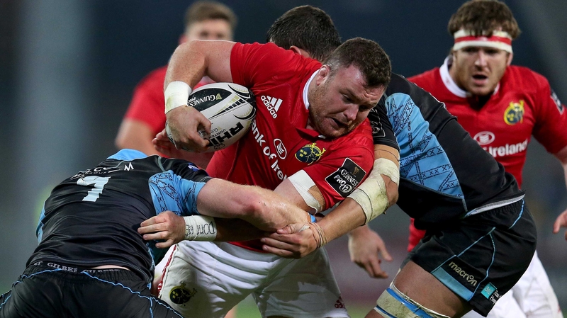 Munster's Dave Kilcoyne bursts through Chris Fusaro of Glasgow