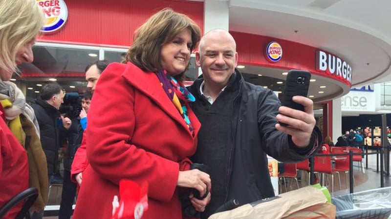 Smile for the camera - but tensions mount on campaign trail