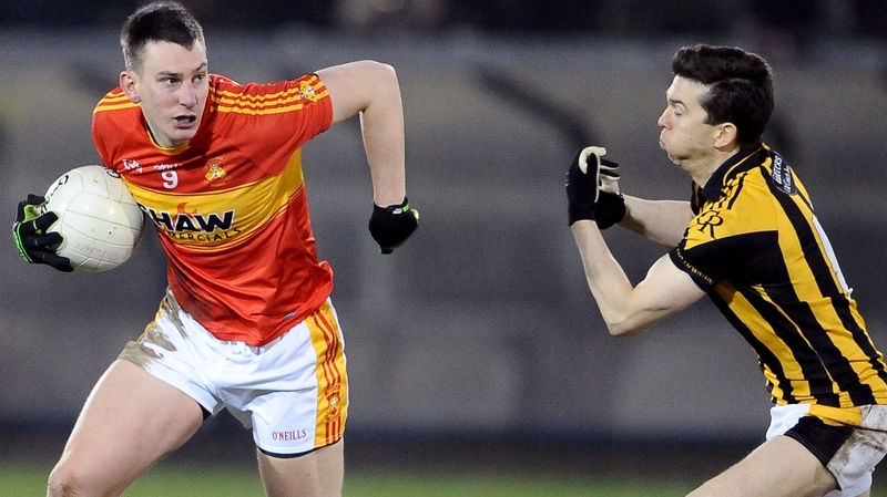 Barry Moran (L) evades Stephen Kernan