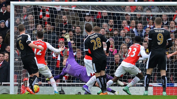 Danny Welbeck beats Kasper Schmeichel in the Leicester goal with a glancing header