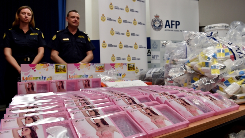 Gel bra inserts (foreground L) containing concealed crystal methamphetamine are seen at the AFP HQ in Sydney