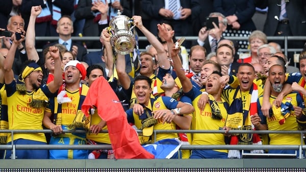 Arsenal players celebrate winning last year's FA Cup final at Wembley