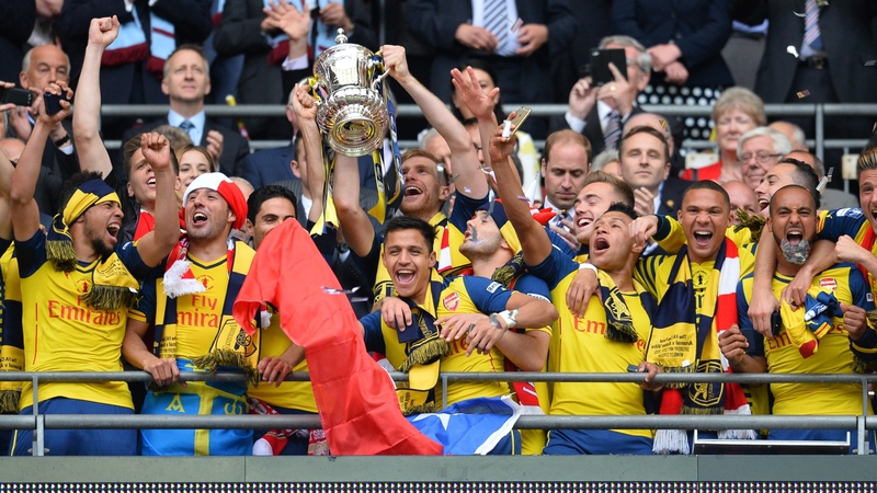 Arsenal players celebrate winning last year's FA Cup final at Wembley