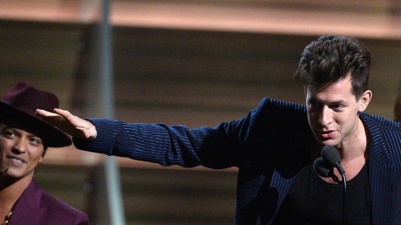 (L-R) Bruno Mars and Mark Ronson on stage receiving the Record of the Year award