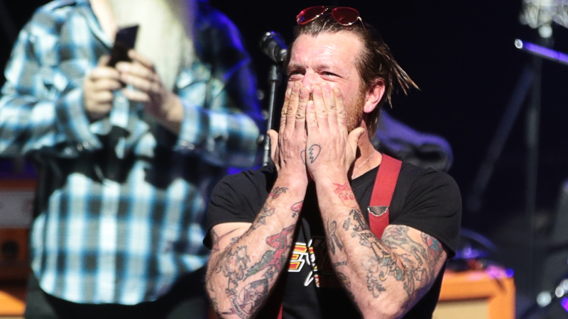 Jesse Hughes cries out for "peace, love and rock and roll" at Paris gig