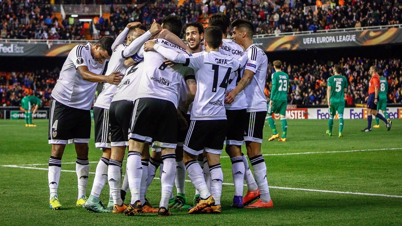 Valencia's players celebrate a goal against Rapid Vienna
