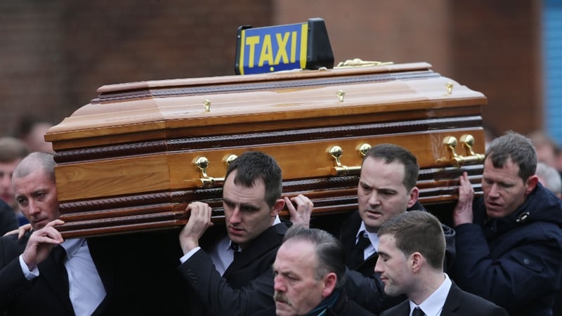 The coffin of Eddie Hutch is carried into Our Lady of Lourdes Church in Dublin