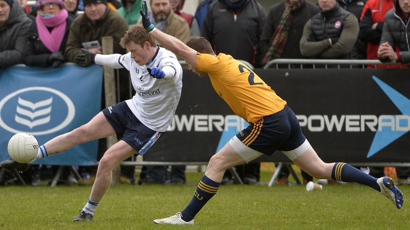 DCU's Michael Quinn attempts to block UUJ's Ricky Johnston