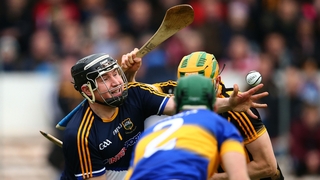 Tipperary goalkeeper Darren Gleeson gets the ball away - just - under pressure from Kilkenny's John Power