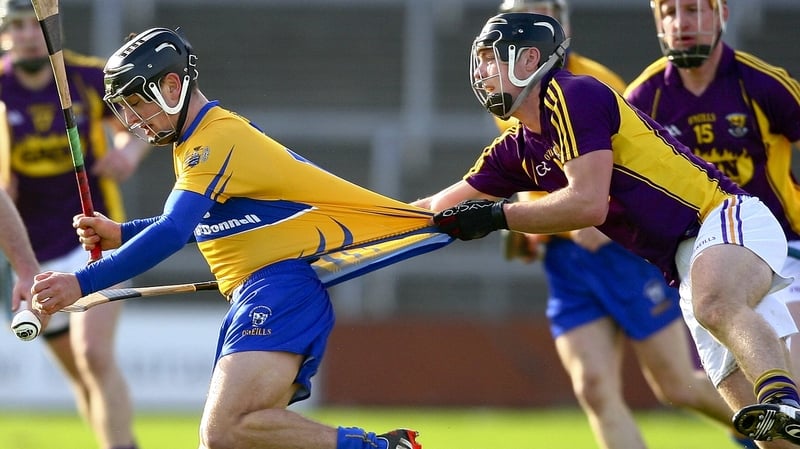Clare's David Reidy evades Wexford's Aidan Nolan