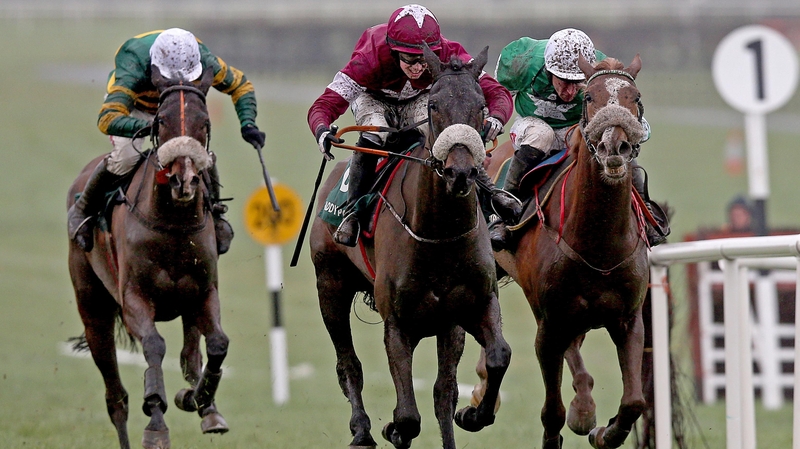 Ball D'Arc ridden by Bryan Cooper, centre, on the way to victory