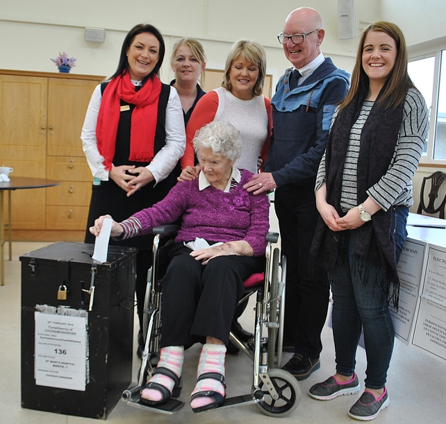 103-year-old Molly Loughman, one of the oldest women to vote in the election, casts her ballot in Castleblayney, Co Monaghan