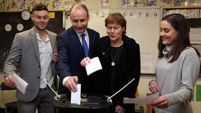 Fianna Fáil Leader Micheál Martin, casts his vote with family members son Micheál Aodh, wife Mary, and daughter Aoibhel at St Anthony's Boys Primary School in Ballinlough, Cork
