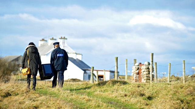 Garda Margaret Byrne carries a ballot box with Magella Harkin from a boat to the polling station on the Island of Innishfree, Co Donegal, where two people voted
