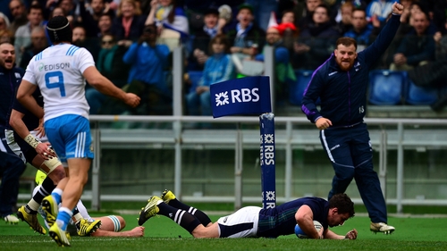 John Hardie of Scotland touches down
