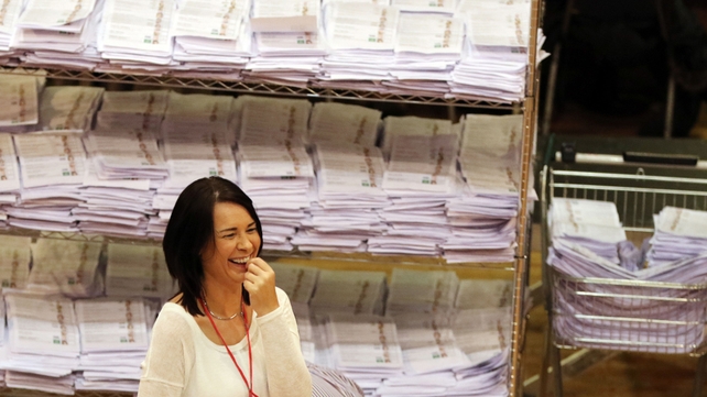 A count worker in Castlebar enjoys a lighter moment as ballot papers are piled up