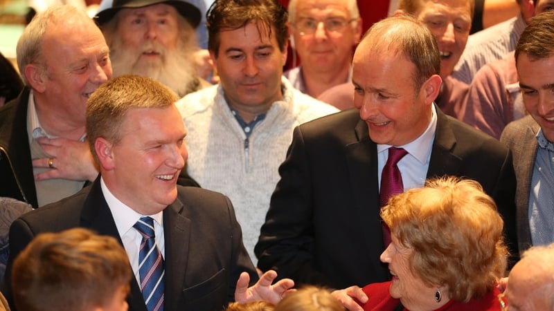 Michael McGrath (L) and party leader Micheál Martin are in jubilant form after their win