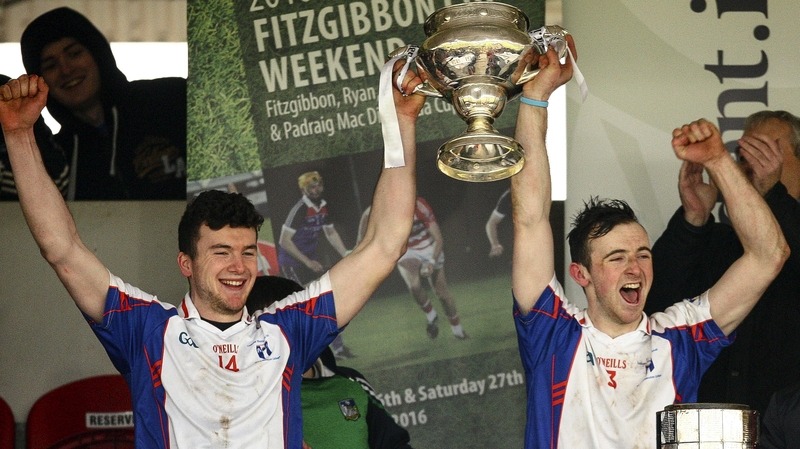 Mary Immaculate's Declan Hannon and captain Richie English hoist the Fitzgibbon Cup