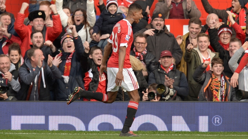 Manchester United's English striker Marcus Rashford (C) celebrates scoring his second goal