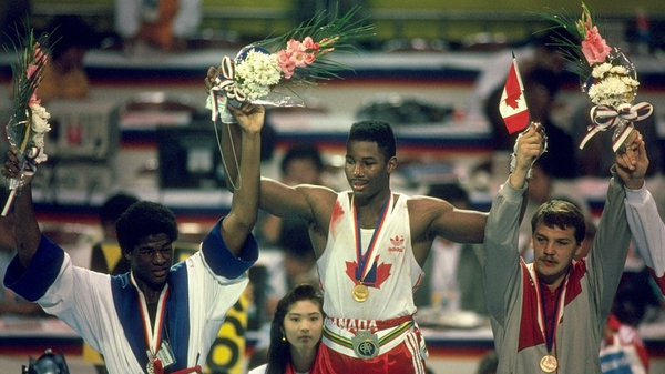 Lennox Lewis (C) won gold for Canada at the 1988 Olympics