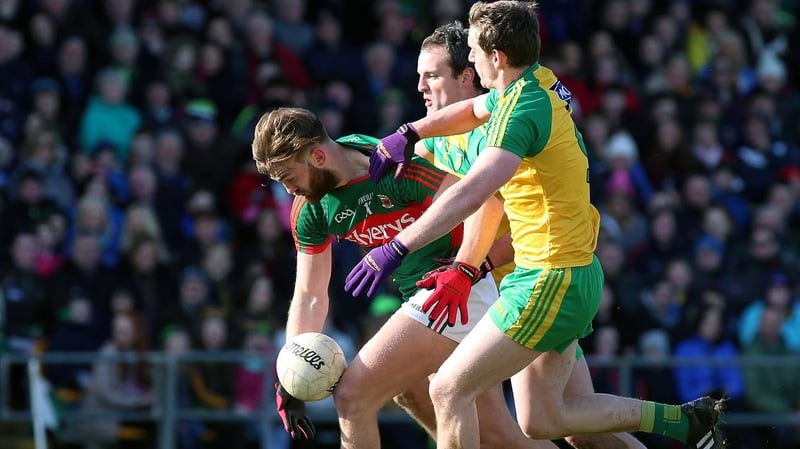 Mayo's Aidan O'Shea is well marshalled by Donegal duo Michael Murphy and Hugh McFadden