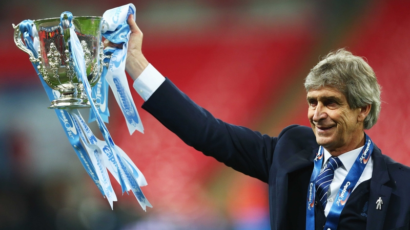 Manuel Pellegrini shows off Manchester City's newest piece of silverware