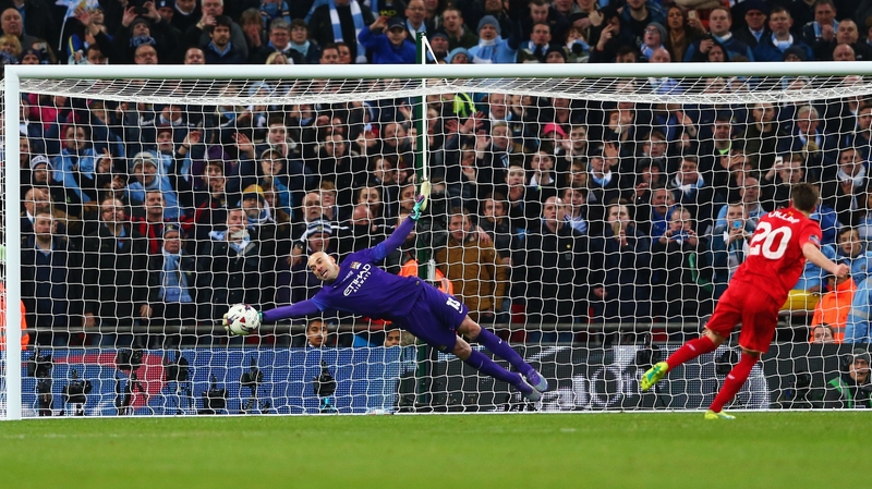 Willy Caballero saves Adam Lallana's penalty during the Capital One Cup Final shootout