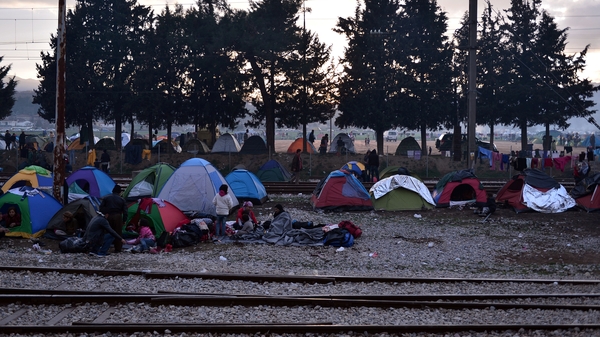 Migrants in tents at a makeshift camp on the Greek border with Macedonia