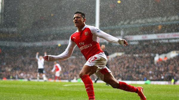 Alexis Sanchez celebrates scoring his equaliser at White Hart Lane