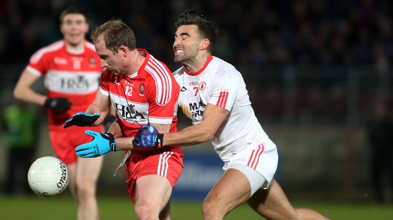Derry's Sean Leo McGoldrick and Tienan McCann of Tyrone battle for possession at Healy Park
