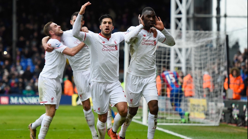 Christian Benteke celebrates his late winner with his Liverpool team-mates