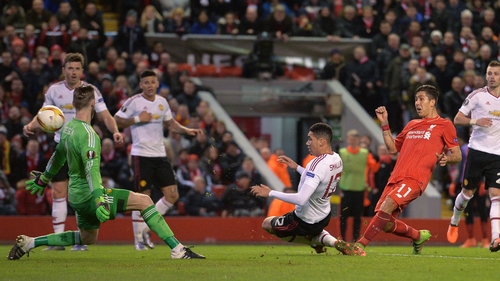 Roberto Firmino stabs home Liverpool's second goal