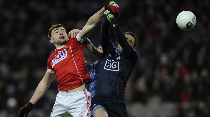 Cork’s Peter Kelleher rises with goalkeeper Michael Savage of Dublin