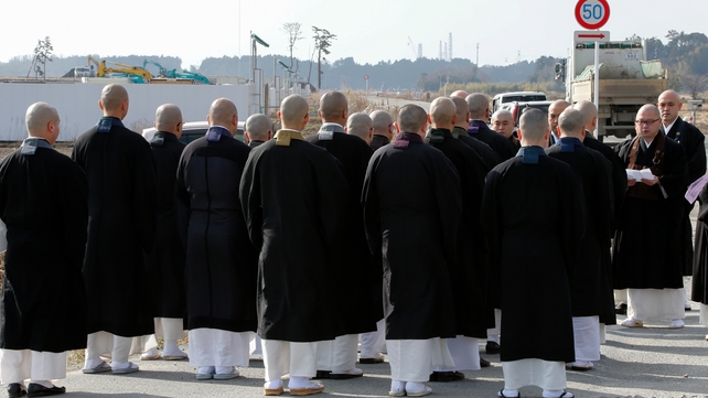 Buddhist monks hold a memorial service for victims in the tsunami-devastated Ukedo district, just 5km north of the Fukushima Daiichi Nuclear Power Plant