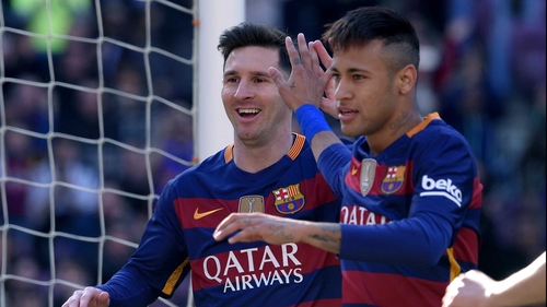Lionel Messi (L) and Neymar celebrate a Getafe own goal