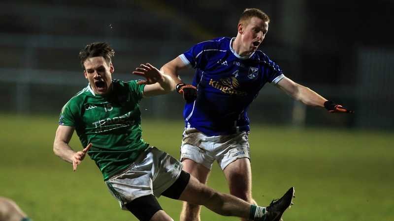 Fermanagh's Tomas Corrigan Jason McLoughlin of Cavan battle for possession at Brewster Park