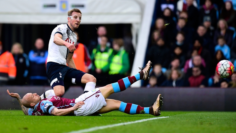 The masked avenger Harry Kane struck twice as Tottenham closed the gap with Leicester
