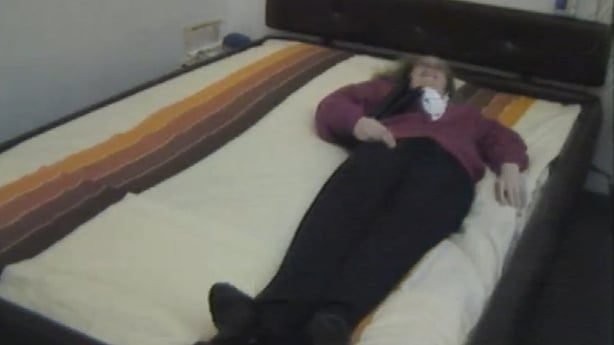 A woman lying on a waterbed