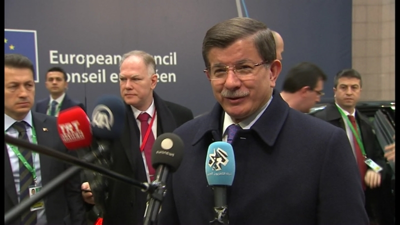 Turkey's Ahmet Davutoglu speaking before entering the meeting