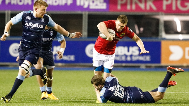 Munster's Andrew Conway is tackled by Cardiff Blues' Garyn Smith