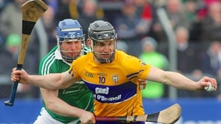 Clare's John Conlon evades Richie McCarthy of Limerick
