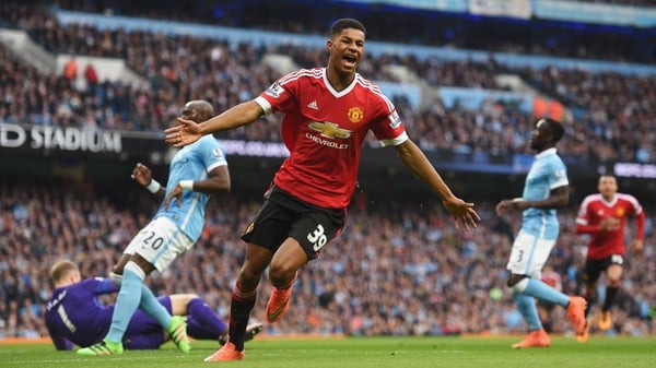 Marcus Rashford wheels away in celebration