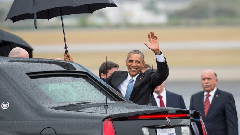 US President Barack Obama waves as he gets in his limousine upon arrival at the Jose Marti International Airport in Havana, Cuba