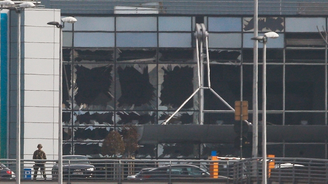 Destroyed windows at the terminal building after the explosions at Brussels Airport in Zaventem