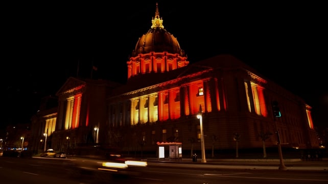 San Francisco City Hall is illuminated in the colors of the Belgium national flag